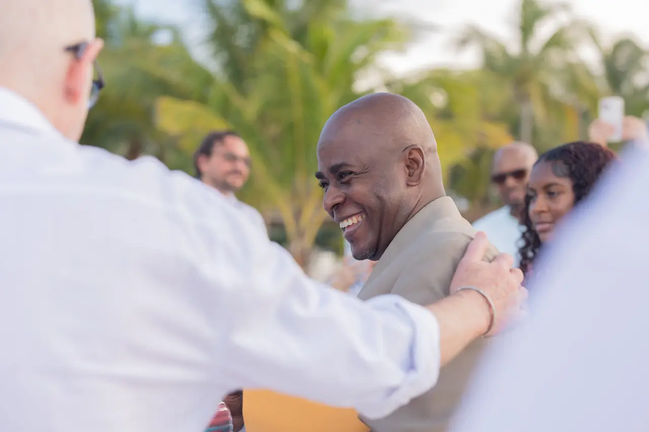 Antonio greeting a guest after the ceremony